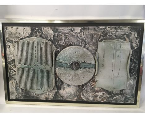 A framed three dimensional sculpture with raised glazed ceramic plaques by Bernard Rooke . 94x59cm