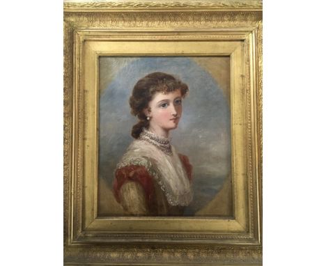 A framed 19th century portrait of a young lady the reverse of the picture with a later applied label Fenal Lebasque and one o