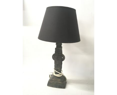 A Contemporary ceramic lamp in the form of an adapted design totem pole. By Bernard Rooke with shade. Height 57cm