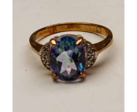 9ct gold dress ring set with light blue stone size M,2.8g. 