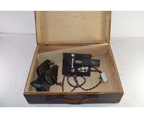 WOODEN CASE CONTAINING A VINTAGE ELECTRIC FILM VIEWER AND TWO HAND OPERATED MACHINES MARKED "SPORTICO"