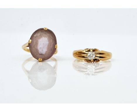 An 18ct gold single stone diamond ring and an amethyst dress ring (2)The diamond single stone ring, claw set with a cushion s