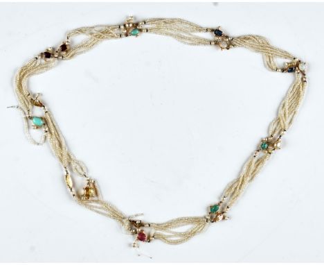 A seed pearl and gem set long necklaceProbably Indian, first quarter of the 20th century, the four row seed pearl long neckla