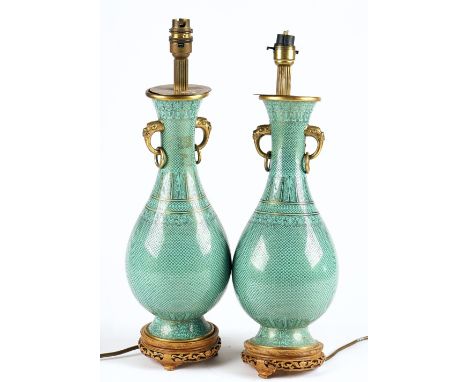 A pair of Chinese green-ground cloisonné vase mounted as lamps20th centuryeach pear shaped body decorated with a gilt scale p