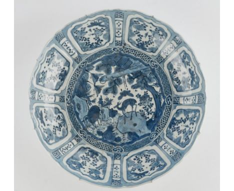 A Chinese blue and white kraak porcelain dish.early 17th centurypainted with two deer in a landscape beneath a border reserve