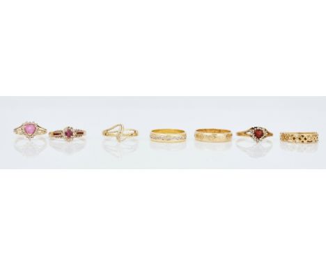 An 18ct two colour gold band ring and six further gold rings (7)The 18ct two colour band ring, size L and a half, weight 3.6 