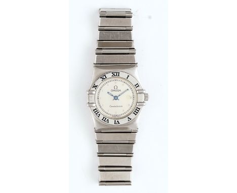 An Omega Constellation steel lady's bracelet wristwatchWith a signed circular silvered dial, the tapered bracelet having a fo