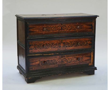An Italian marquetry inlaid walnut commode17th / 18th century, with three long drawers, 131cm wide; 103cm high; 60cm deep