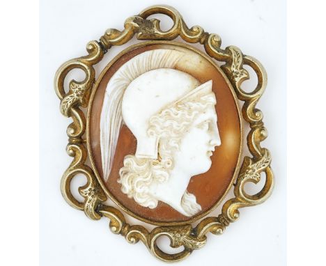 A mid-19th century carved shell cameo broochcarved with the portrait of a classical warrior wearing a helmet within a scroll 