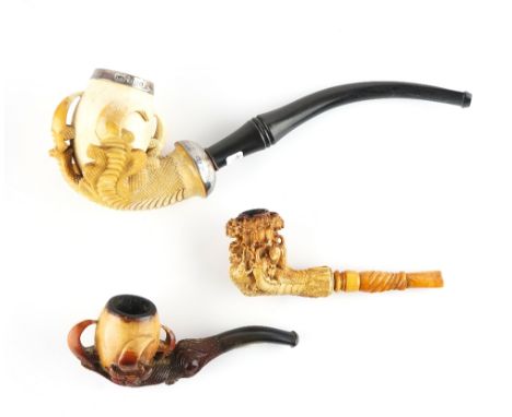 THREE MEERSCHAUM PIPES (3)19th CenturyOne modelled as an eagle's talon with silver mounts hallmarked for Birmingham 1892, pre