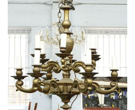 A Dutch brass twelve-light chandelier20th centuryWith scroll branches below a baluster column, in the 18th century style95 cm