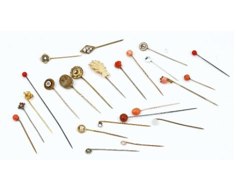 A collection of stick pins (24)Including; an opal stick pin, a gold topped and cultured pearl stick pin, detailed 9 CT, two c