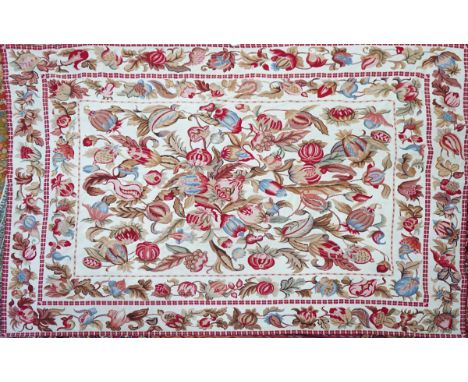 A tapestry carpetthe ivory background with naturalistic entwined autumnal flowers and fruits, matching border, 288cm long; 23