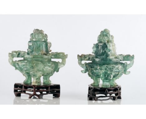 A pair of Chinese green fluorite censerslate 19th/20th centuryeach carved with animal mask and ring handles supported on thre