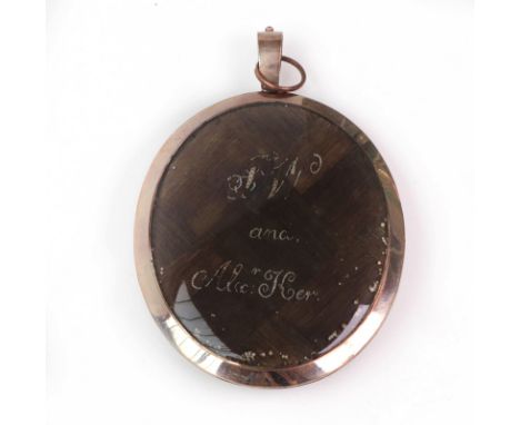A large George III gold, enamel and hair-work mourning pendant/locketLate 18th/Early 19th centuryThe reverse with a blue enam