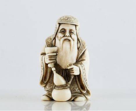 A Japanese ivory netsuke of a bearded old manfirst half 20th centurycarved standing holding a goblet and double gourd flask, 