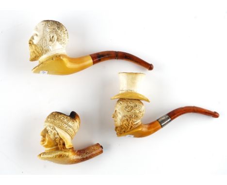 THREE FIGURAL MEERSCHAUM PIPES (3)19th CenturyTo include; one modelled as a priest and detailed '1709-1722' (lacking mouthpie