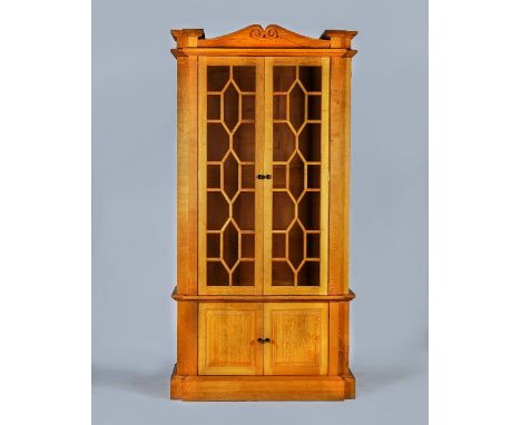 LINLEY; a pair of oak astragal glazed bookcase cabinets125cm wide;  244 high; (2)These bookcases were designed by David Linle