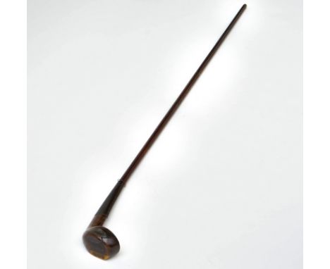 A mahogany Sunday golf club walking stickLate 19th centuryThe head with a lead back weight and bone footplate,&nbsp;stamped G