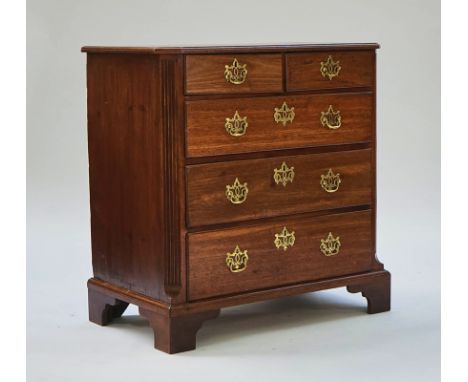 An English mahogany chest.Mid 18th century, with two short and three long graduated drawers flanked by reeded canted corners 