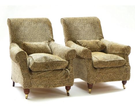 A pair of easy armchairsModern, with loose leopard print upholstery on turned supports, 80cm wide; 92cm high (2)