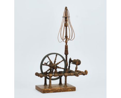 A miniature spinning wheel19th CenturyWith bobbin turned decoration42cm wide; 64cm high
