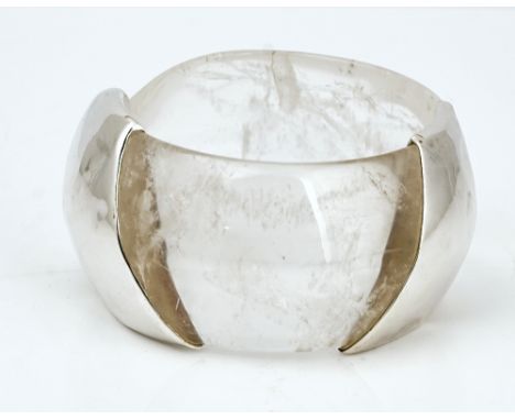 A silver mounted rock crystal bangleOf abstract design, detailed 925 BH, minimum internal diameter 6.5cm, width 4cm