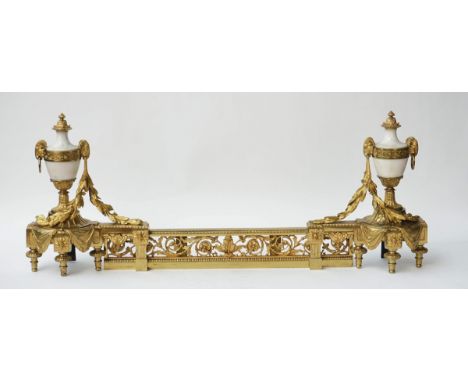 A pair of gilt-metal and white marble chenetsIn the Louis XVI style, 20th CenturyModelled as urns with rams' head masks; and 