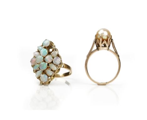 A gold and opal marquise shaped cluster ring and another ring (2)The gold and opal ring decorated with a ribbon twist border 