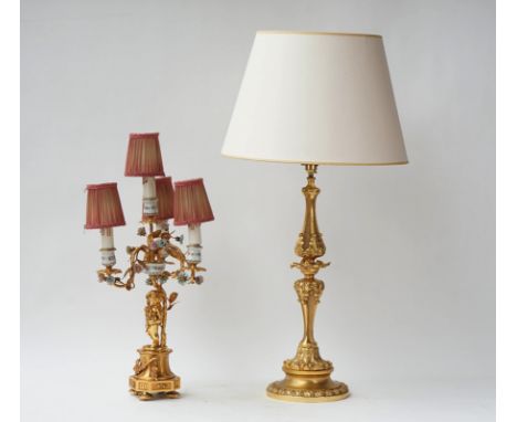 An Italian gilt-metal and porcelain mounted four light candelabraModernModelled as a cherub below three scroll branches with 