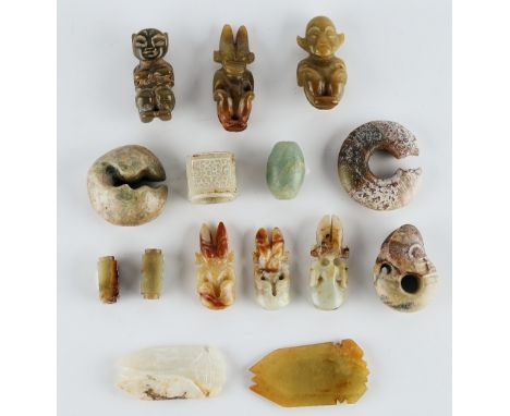 A group of Chinese archaistic jade carvingscomprising: six `alien' figures, tallest 7cm; two cicadas, largest 8cm. high; two 