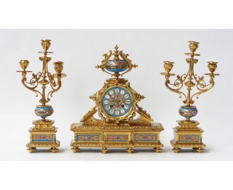 A French gilt-metal and porcelain clock garnitureLate 19th CenturyThe mantel clock of architectural form, with blue painted p