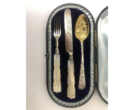 A Georgian and early Victorian three piece silver christening set, the George III spoon with engraved foliate handle and gild