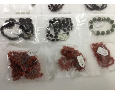 Group of necklaces and bracelets to include garnet, amethyst, freshwater cultured pearls and coral. (Qty: 11)