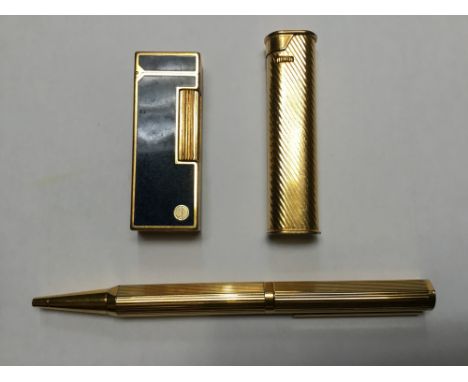 Alfred Dunhill gold plated ball point pen, together with two Dunhill lighters (3)