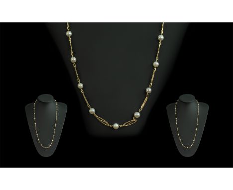18ct Gold Attractive Necklace set with cultured pearl spacers, marked 750 - 18ct; weight 15.7g, length 26 inches (65cms) Good