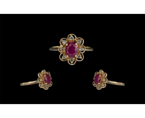 18ct Gold Attractive Ruby and Diamond Set Cluster Ring. Marked 18ct to Interior of Shank. The Ruby and Diamonds of Excellent 