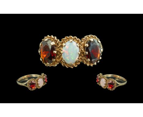 Ladies 9ct Gold Attractive 3 Stone Garnet and Opal Set Ring, Ornate Setting. Hallmark Birmingham 1978, Ring Size Q. Weight 3,