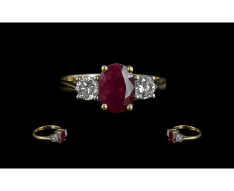 18ctb Gold Attractive Quality 3 Stone Ruby and Diamond Set Ring, the central faceted ruby flanked by 2 good quality diamonds;