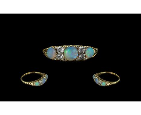 Antique Period Attractive 18ct Gold Opal and Diamond Set Ring with gallery setting and hallmarked 750 - 18ct to interior of s