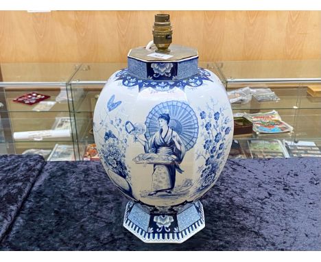 A Dutch Delft Ware Blue and White Lamp Base in the Chinoiserie design depicting figures foliage Butterflies etc Height includ