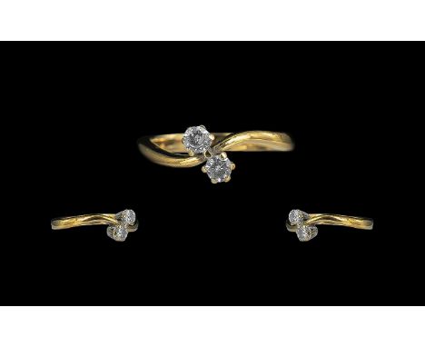 18ct Gold - Attractive 2 Stone Diamond Set Crossover Ring. Full Hallmark to Shank. The Round Brilliant Cut Diamonds of Good C