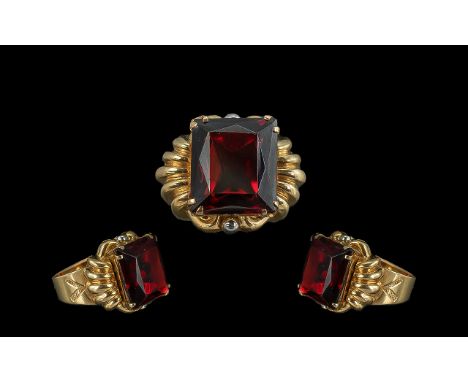 18ct Gold Superb Quality Single Ruby Coloured Faceted Stone Set Ring.  Marked 750 to interior of shank.  The large faceted sq