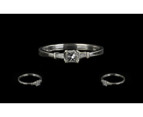 18ct Gold Princess Cut Single Stone Diamond Ring with tapered Baguette cut shoulders. Ring size P.