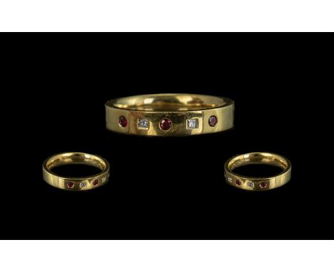 18ct Ruby &amp; Diamond Eternity Ring, set with alternating round Ruby and Princess cut diamonds.  Fully hallmarked, ring siz