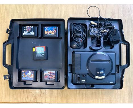 Sega Mega Drive Games Console, in fitted black hard shell case, 16-Bit, with controller etc. Comes with games comprising Supe