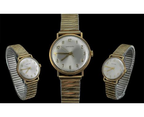 Garrard Gents 9ct Gold Cased Mechanical Wrist Watch, circa 1980.  Mother of Pearl dial, gold tone numerals.  Expanding gold t