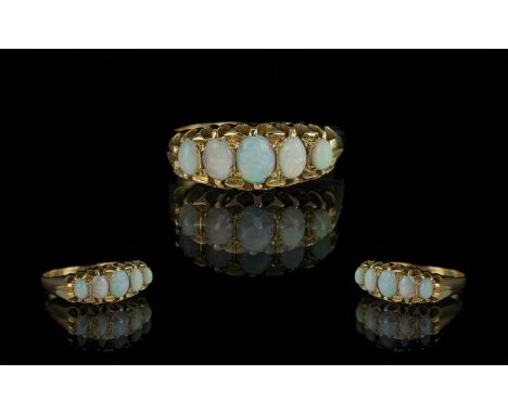 Antique Period Attractive 18ct Gold Five Stone Opal Set Ring, the well matched opals of good colours.  Gallery setting.  Not 