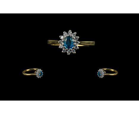 18ct Sapphire and Diamond Cluster Ring with central sapphire surrounded by 12 round cut diamonds. Fully hallmarked. Ring size