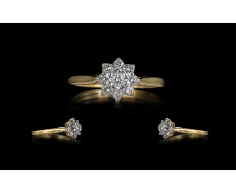 18ct Gold Attractive Diamond Set Cluster Ring, Flower head Design. Marked 18ct. Diamond Weight 0,25 pts. Stamped to Interior 